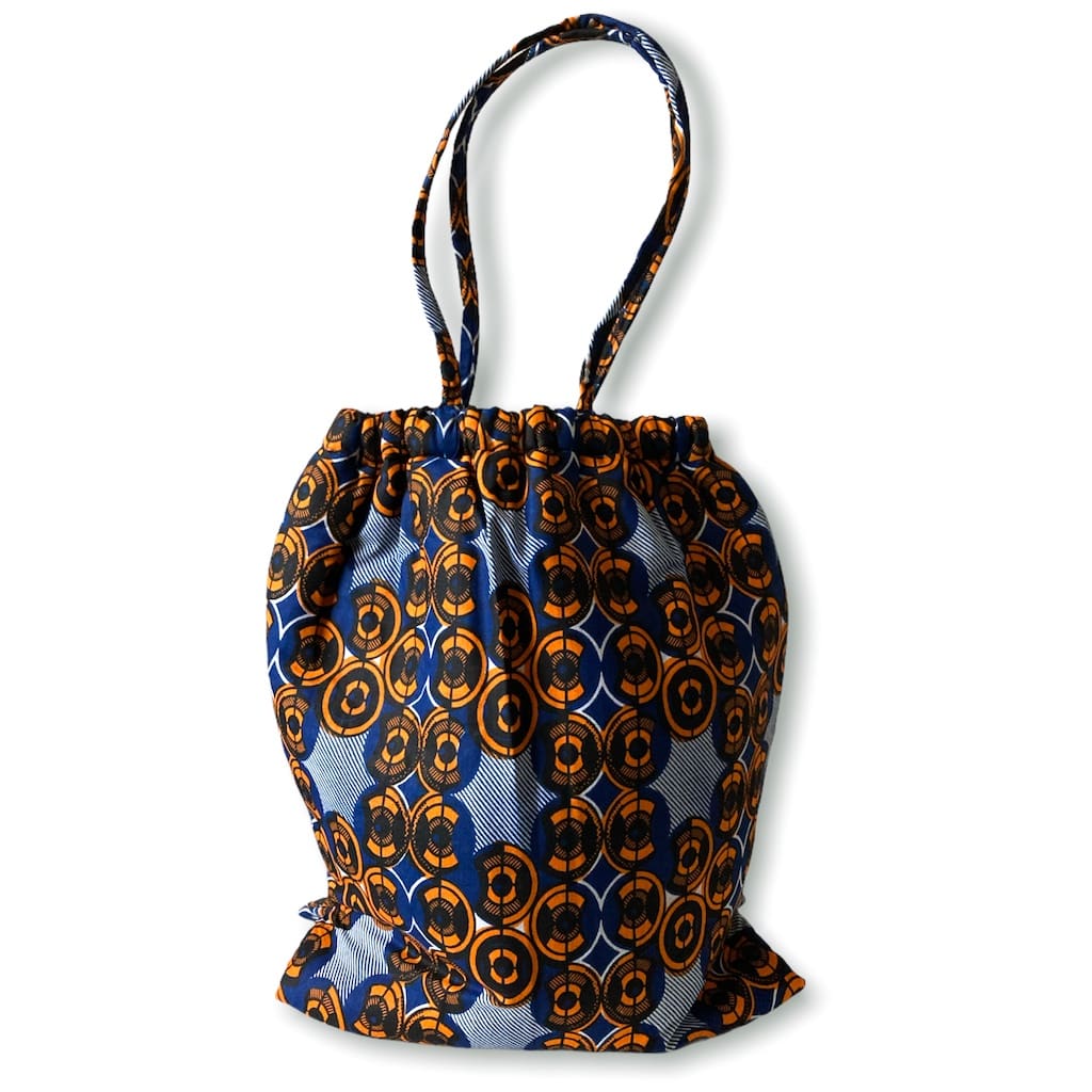 ワックスプリント巾着型バッグ - ORANGE CIRCLE - Borderless Creations